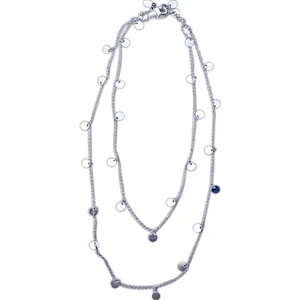 The Kate New Style - Shimmering Silver Tone Disks Reflect Light Off Of A A Silver Toned Chain. Sil