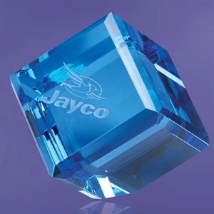 Giannico - A Blue Cube Shaped Paperweight, Balanced On A Flattened Point