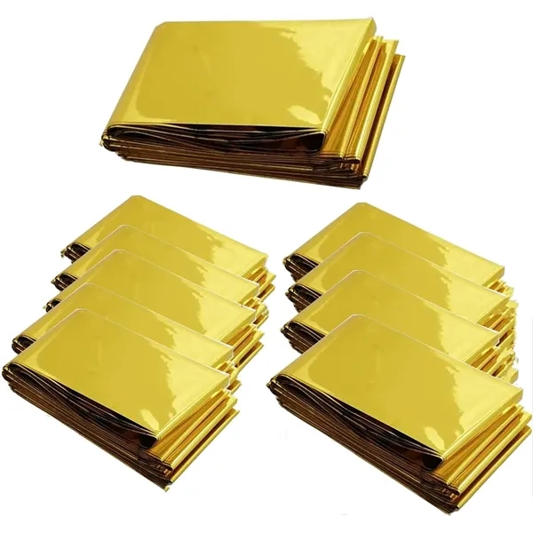 Silver and gold foil survival blanket outdoors - Silver and gold foil survival blanket outdoors - Image 2 of 9