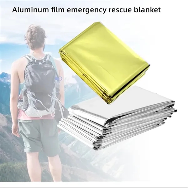 Silver and gold foil survival blanket outdoors - Silver and gold foil survival blanket outdoors - Image 5 of 9