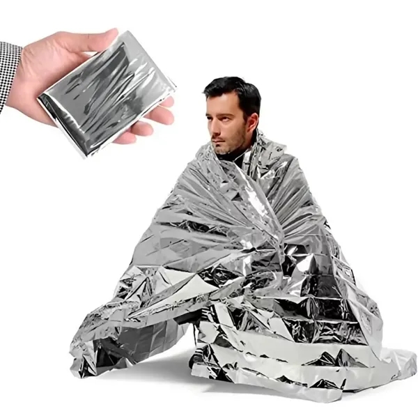 Silver and gold foil survival blanket outdoors - Silver and gold foil survival blanket outdoors - Image 9 of 9
