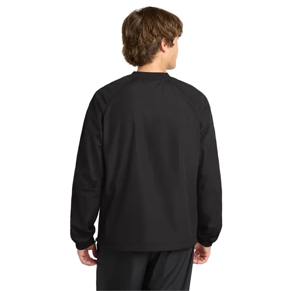 Sport-Tek V-Neck Raglan Wind Shirt.