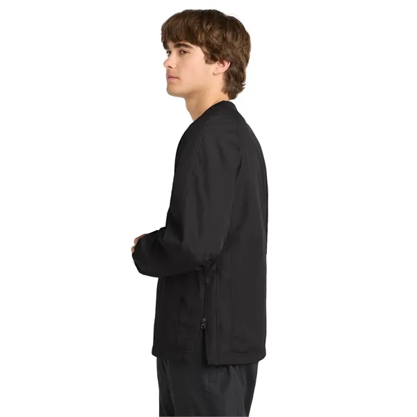 Sport-Tek V-Neck Raglan Wind Shirt.