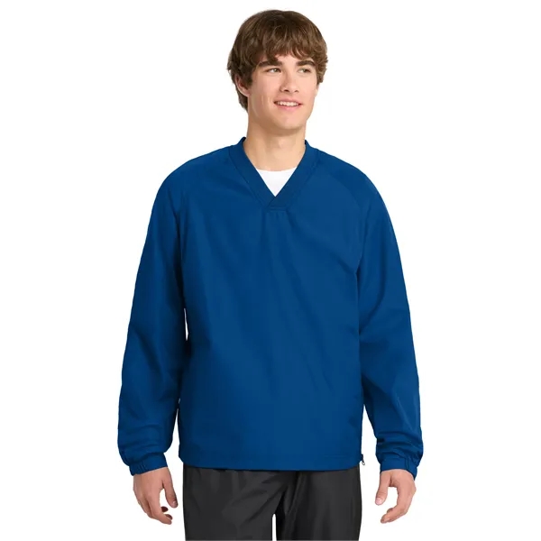 Sport-Tek V-Neck Raglan Wind Shirt.