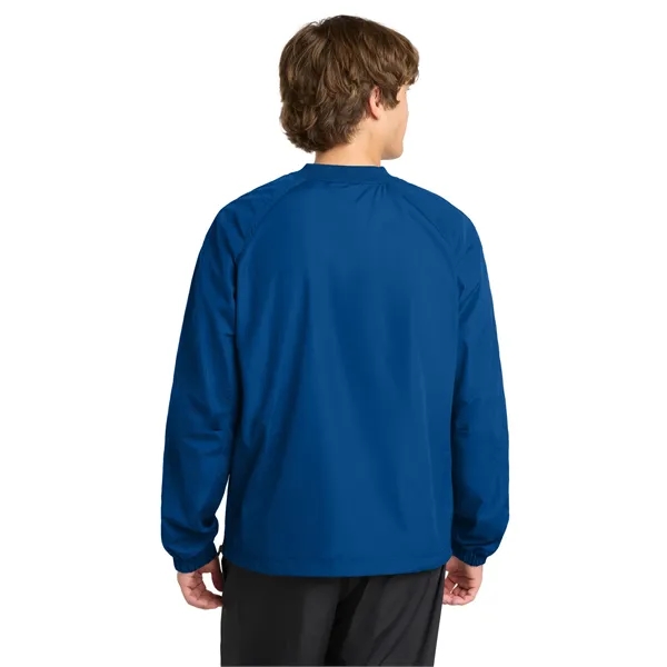 Sport-Tek V-Neck Raglan Wind Shirt.
