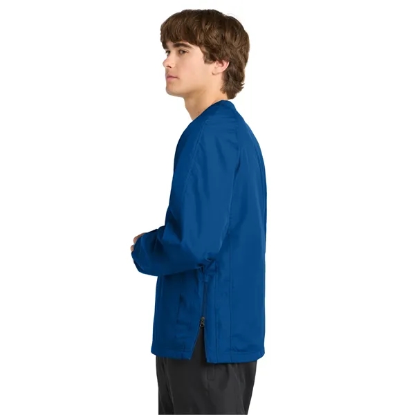 Sport-Tek V-Neck Raglan Wind Shirt.