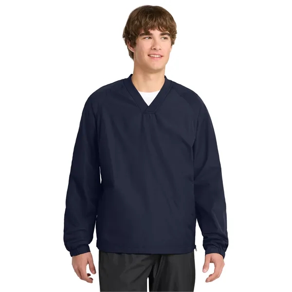Sport-Tek V-Neck Raglan Wind Shirt.