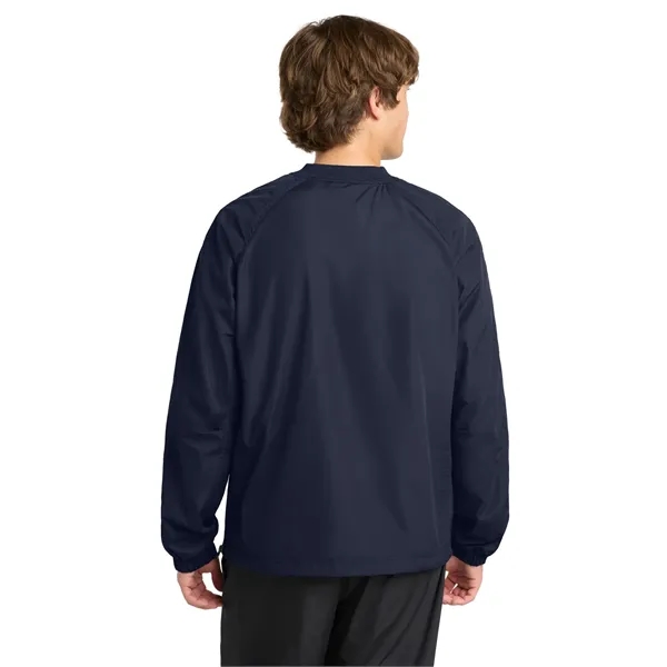 Sport-Tek V-Neck Raglan Wind Shirt.