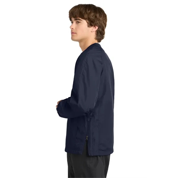Sport-Tek V-Neck Raglan Wind Shirt.