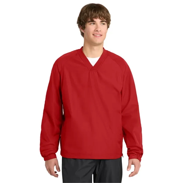 Sport-Tek V-Neck Raglan Wind Shirt.