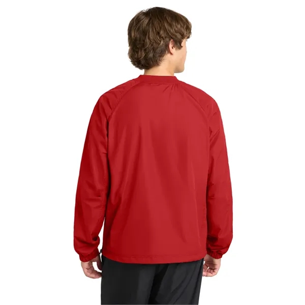 Sport-Tek V-Neck Raglan Wind Shirt.