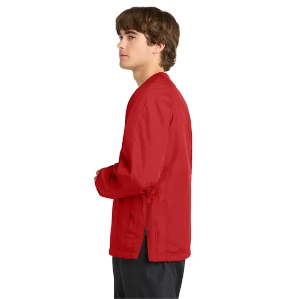 Sport-Tek V-Neck Raglan Wind Shirt.