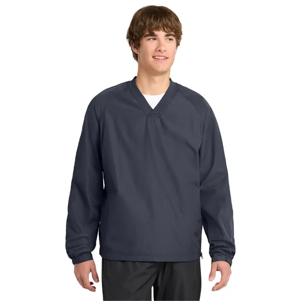 Sport-Tek V-Neck Raglan Wind Shirt.